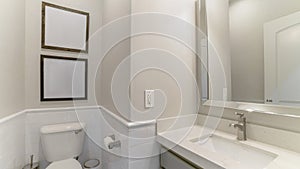 Pano Interior of a bathroom with built-in sink with cabinet and mirror