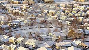 Pano Picturesque residential community in the valley on a snowy landscape in winter