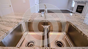 Pano Stainless steel sink with double basin on a kitchen island of newly built house