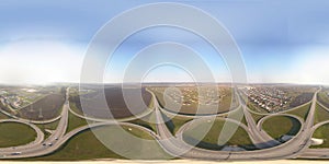 Panorama by 360 degrees angle seamless panorama of aerial view of highway intersection junction summer morning with car
