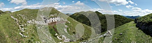 Panorama with abandoned barracks below of summit of Slatnik in Julian Alps in Slovenia