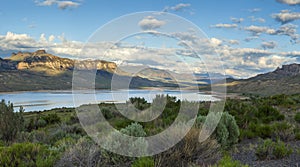 Panorama of the Absaroka Mountains of Wyoming above the Buffalo Bill Reservoir on a bright summer morning photo