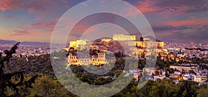 Panorama of The Acropolis of Athens, Greece, with the Parthenon Temple with lights during sunset. Athens, Greece, Europe