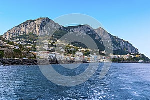 A panorama across the breakwater of the harbour of Marina Grande with Mount Solaro and Anacapri in the distance on the island of