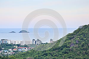 Panorama aerial view of beautiful blue ocean with small islands, mountain, and resort town of Hua Hin, Thailand on peaceful summer