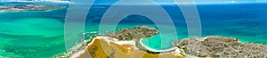 Panorama aerial view of Puerto Rico. Faro Los Morrillos de Cabo Rojo. Playa Sucia beach and Salt lakes in Punta Jaguey.