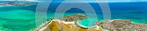 Panorama aerial view of Puerto Rico. Faro Los Morrillos de Cabo Rojo. Playa Sucia beach and Salt lakes in Punta Jaguey. photo