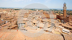 Panorama Aerial View of Siena Historic Old Town, Italy, with Piazza del Campo and Mangia Tower on Palio day photo