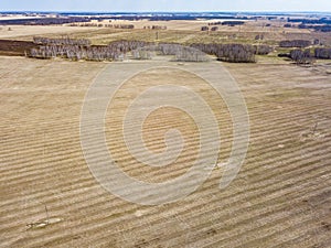 Panorama from the air on the lush meadows and fields with colorful plots of agricultural crops before sowing in spring outside the