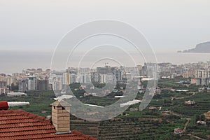 Panorama of Alanya against the backdrop of the sea and mountains, residential development, city by the sea, October 2022