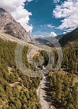 Panorama of a Alpine mountain valley and peaks.