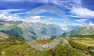 Panorama of the Alps in summer. View on the Emosson dam in Switzerland during Tour du Mont Blanc hike