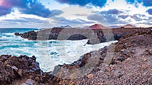 Panorama of the Amazing Los Hervideros lava caves in Lanzarote island at sunset, popular touristic attraction, Canary Islands,