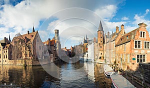 Panorama of the ancient Belgian city of Bruges, overlooking the canal, seagulls and the Belfort tower