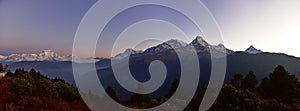 Panorama of Annapurna & Himalaya mountain ranges at dawn as viewed from summit of Poon Hill, Nepal