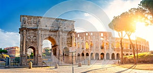 Panorama of the Arch of Constantine and the Colosseum in the morning sun. Rome architecture and landmark