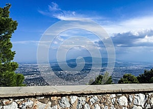 Panorama of Athenes, Greece with houses and Lycabettus Hill against blue sky