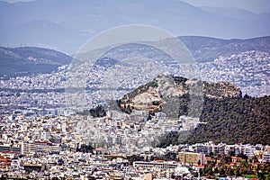 Panorama of Athens, view of Lycabettus Mount from Hymettus Mountain. Cityscape of Athens with old and modern Greek houses