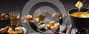 Panorama banner with cheese fondue and beverages