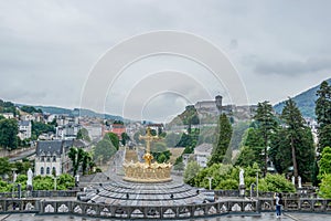 A panorama from Basilica of the Virgin Mary of Rosaire to the Fortress of Lourdes. photo