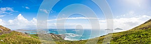 Panorama beach sea view in Ireland ocean coast. Atlantic mountain cliffs and rocks. Beautiful landscape nature.