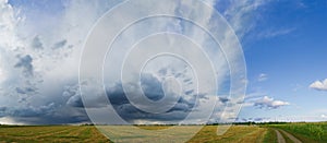 Panorama of the Beautiful Autumn Field under Stormy Sky