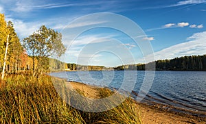 Panorama of beautiful autumn landscape with lake and forest on the Bank of Russia, the Urals