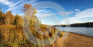 Panorama of beautiful autumn landscape with lake and forest on the Bank of Russia, the Urals