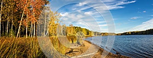 Panorama of beautiful autumn landscape with lake and forest on the Bank of Russia, the Urals