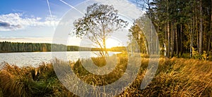 Panorama of beautiful autumn landscape with lake and forest on the Bank of Russia, the Urals