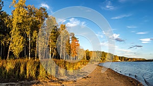 Panorama of beautiful autumn landscape with lake and forest on the Bank of Russia, the Urals