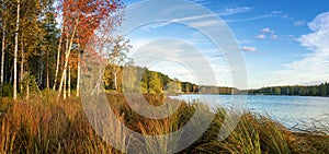 Panorama of beautiful autumn landscape with lake and forest on the Bank of Russia, the Urals