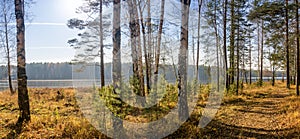 Panorama of beautiful autumn landscape with lake and forest on the Bank of Russia, the Urals