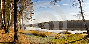 Panorama of beautiful autumn landscape with lake and forest on the Bank of Russia, the Urals