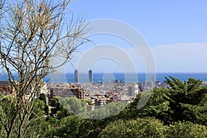 A panorama of beautiful Barcelona from the hill of Park Guel. It\'s a clear sunny day. photo