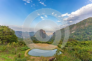Panorama of the beautiful countryside of Northern Thailand. Sunny afternoon. Wonderful spring landscape in mountains, meadows,