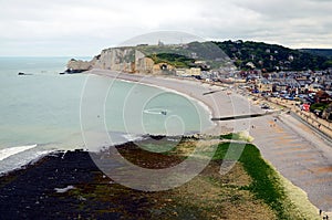 Panorama of a beautiful empty beach and white chalk cliffs and natural arches of Etretat city, Normandy, France, A famous coastal