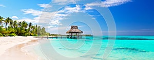 Panorama of beautiful gazebo on the tropical white sandy beach in Punta Cana, Dominican Republic