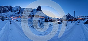 Panorama of beautiful landscape from Reine fishing village at twilight in winter season, Lofoten islands, Norway