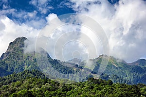 Panorama of beautiful mountains, blue skay and clouds