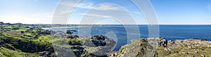 Panorama of beautiful Norwegian green and rocky coastline near Hellestostranden beach