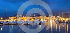 Panorama of beautiful Saint Florent town and harbour, Corsica photo