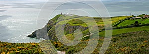 Panorama of beautiful scenery of Howth Head with Baily Lighthouse and green fields, county Dublin, Ireland