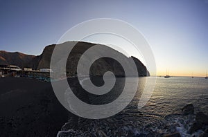 Panorama of Beautiful volcanic beach of Perissa, Santorini island, Greece