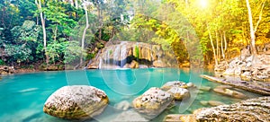 Panorama of beautiful waterfall in wild rainforest in Erawan National park, Thailand