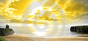 Panorama of a Beautiful yellow sun over the Ballybunion beach