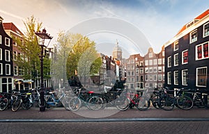 Panorama of beautifull Amsterdam bridge with bicycles, Holland photo