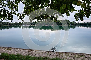 Panorama of bela crkva lakes at dusk with calm water, fishing rods and sunny sky. Also called Belocrkvanska jezera