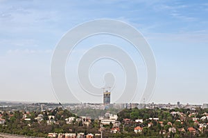 Panorama of the belgrade skyline, seen from above, in Serbia, in spring, with the construction site of high rise skyscraper tower