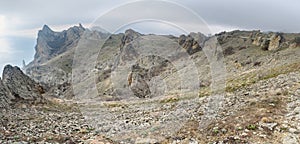 Panorama of Bizarre rocks in Dead city. Khoba-Tele Ridge of Karadag Reserve in spring. Crimea